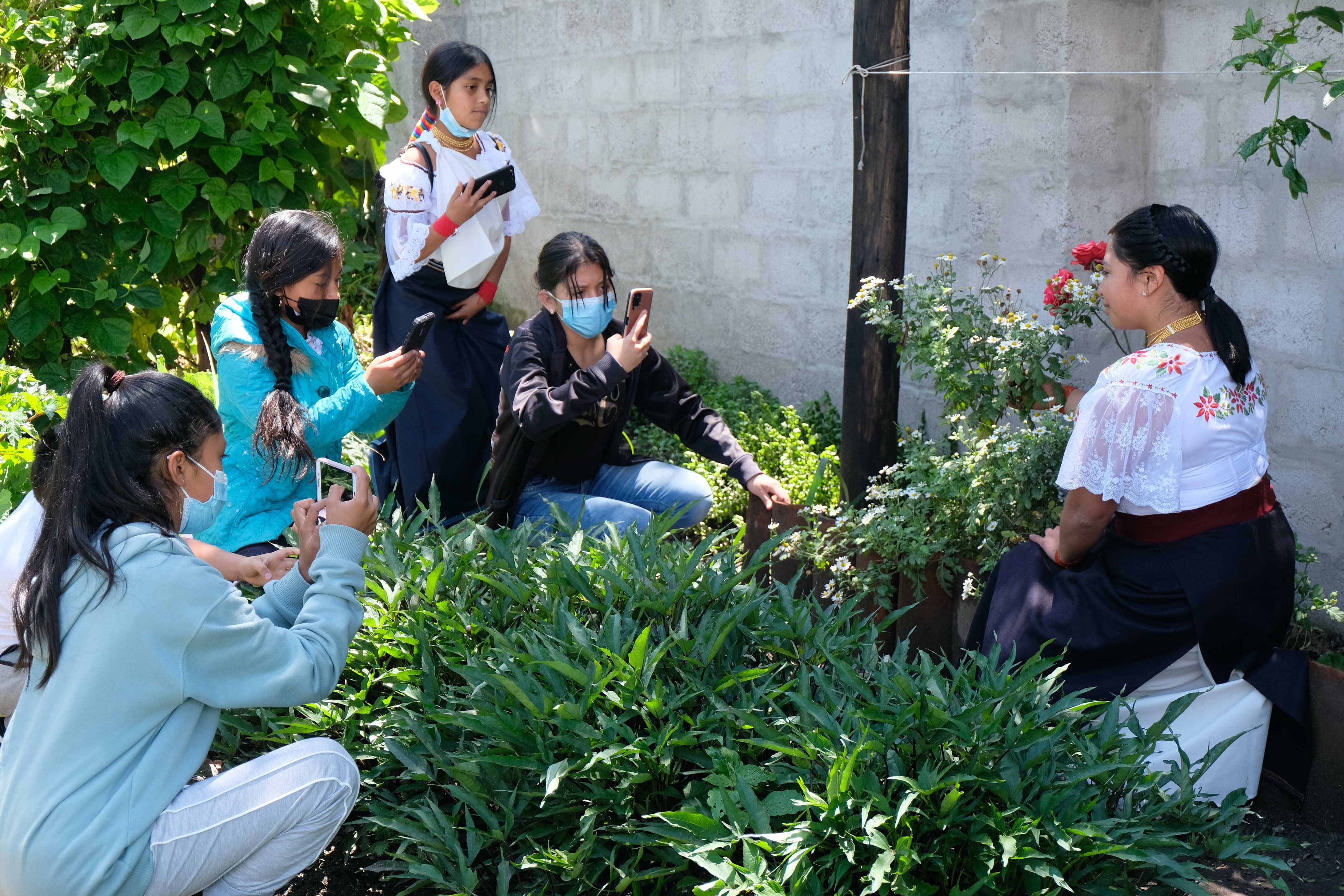 Young people outdoors during a nature and field learning activity.